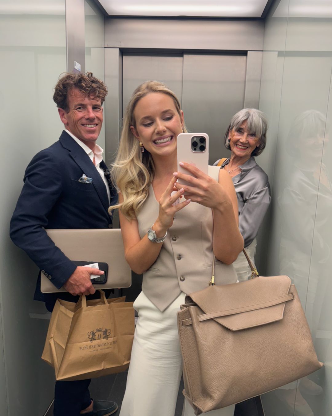 Antonia with two people in an elevator